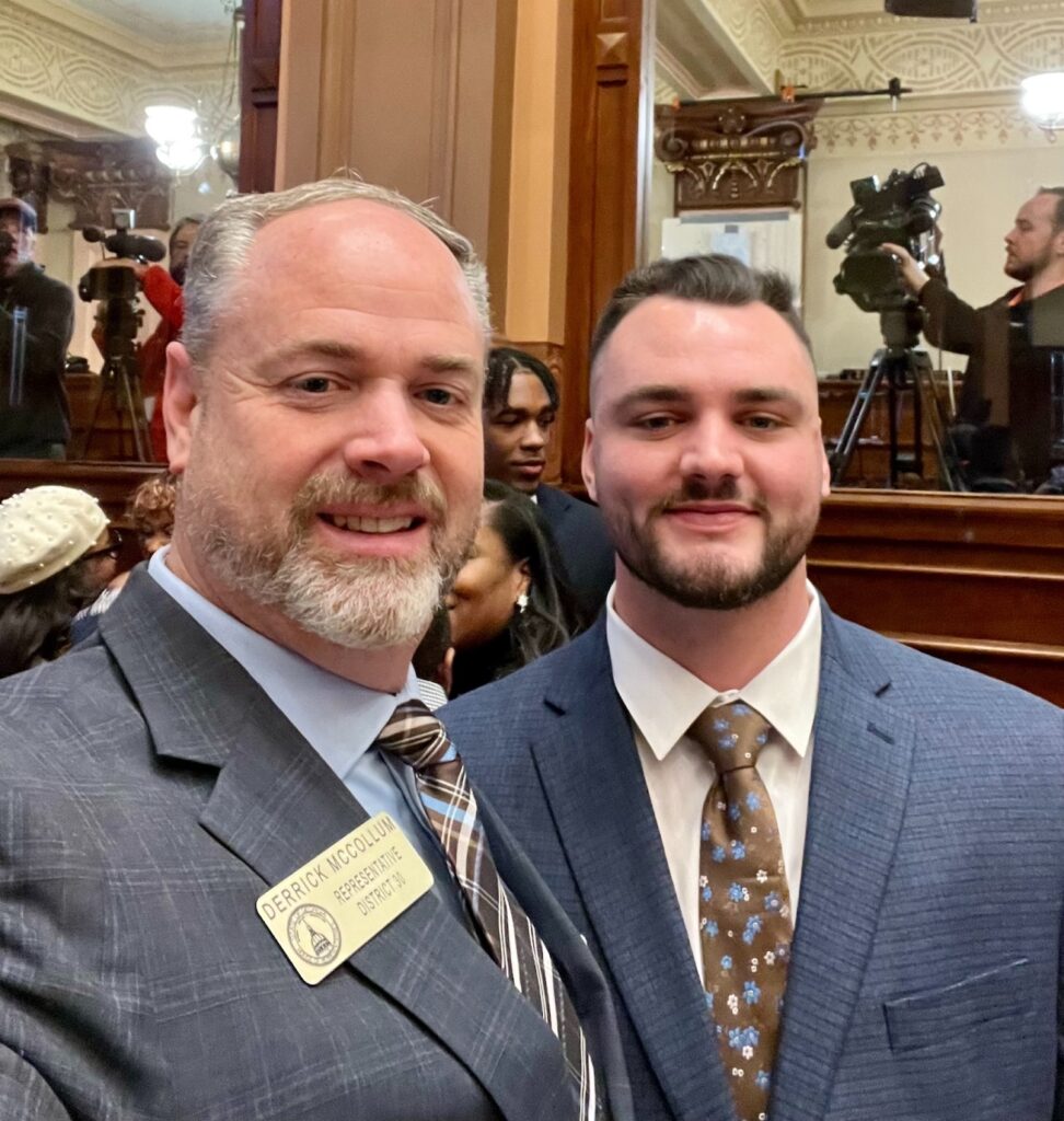 Rep. Derrick McCollum and son in the House chamber